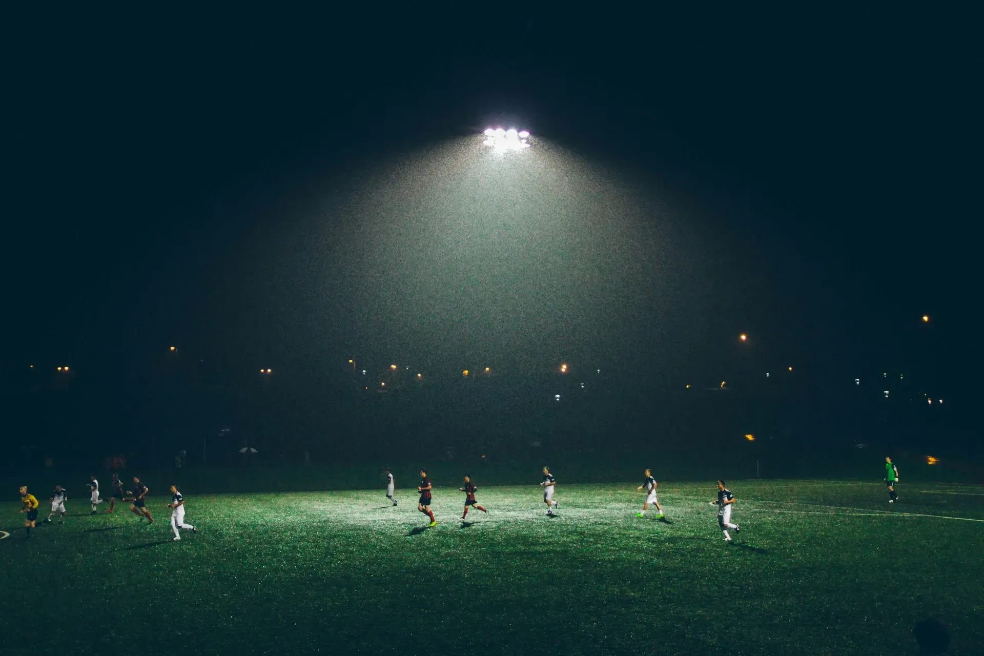 How long is a soccer game in a rec league: a night game on a field lit by a single floodlight