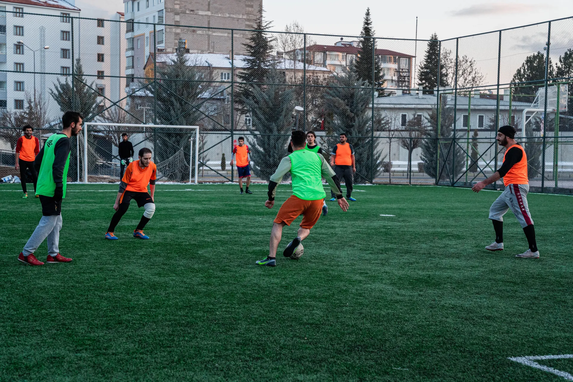 Amateur soccer league players competing during a match